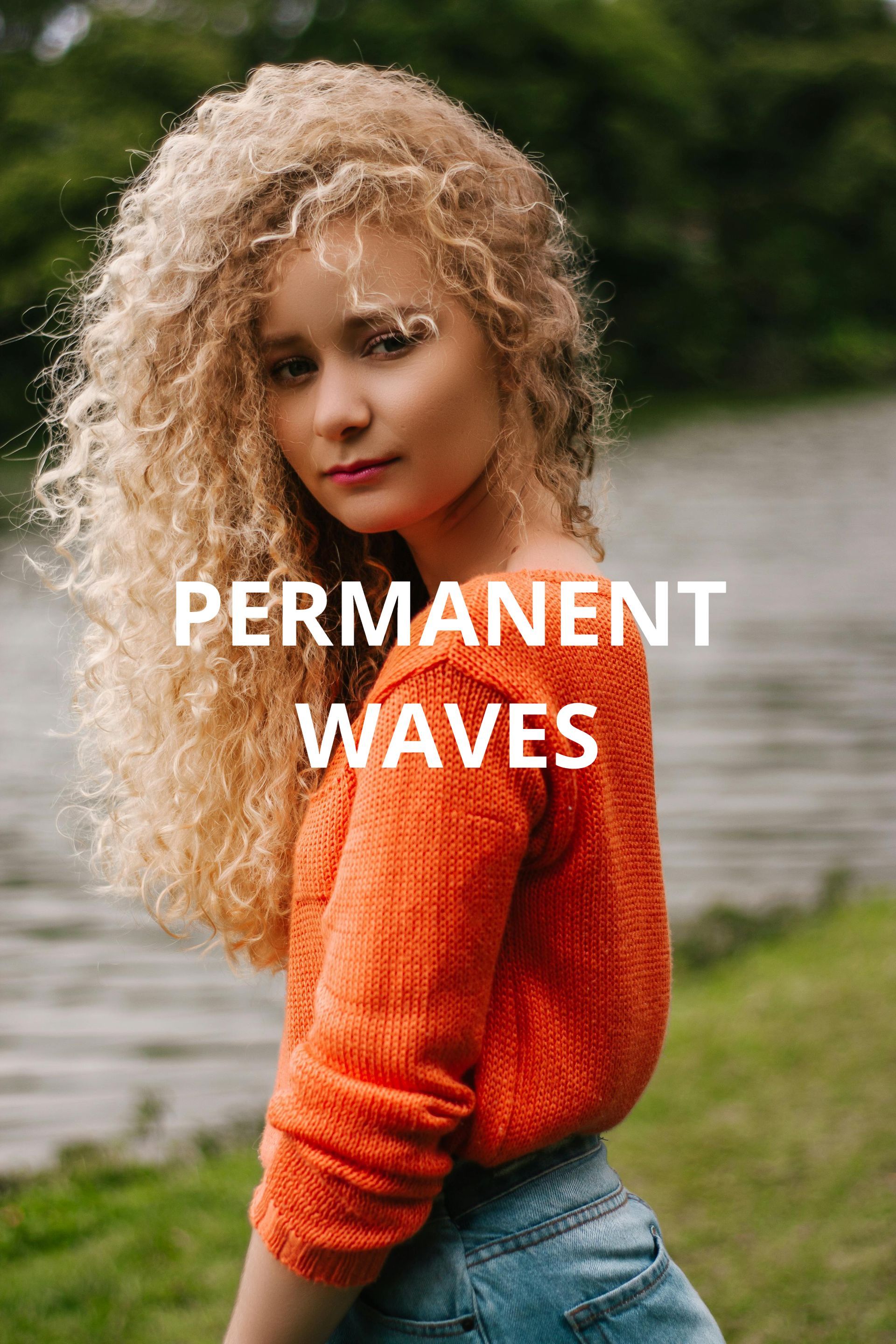 A woman is getting her hair curled by a hairdresser.