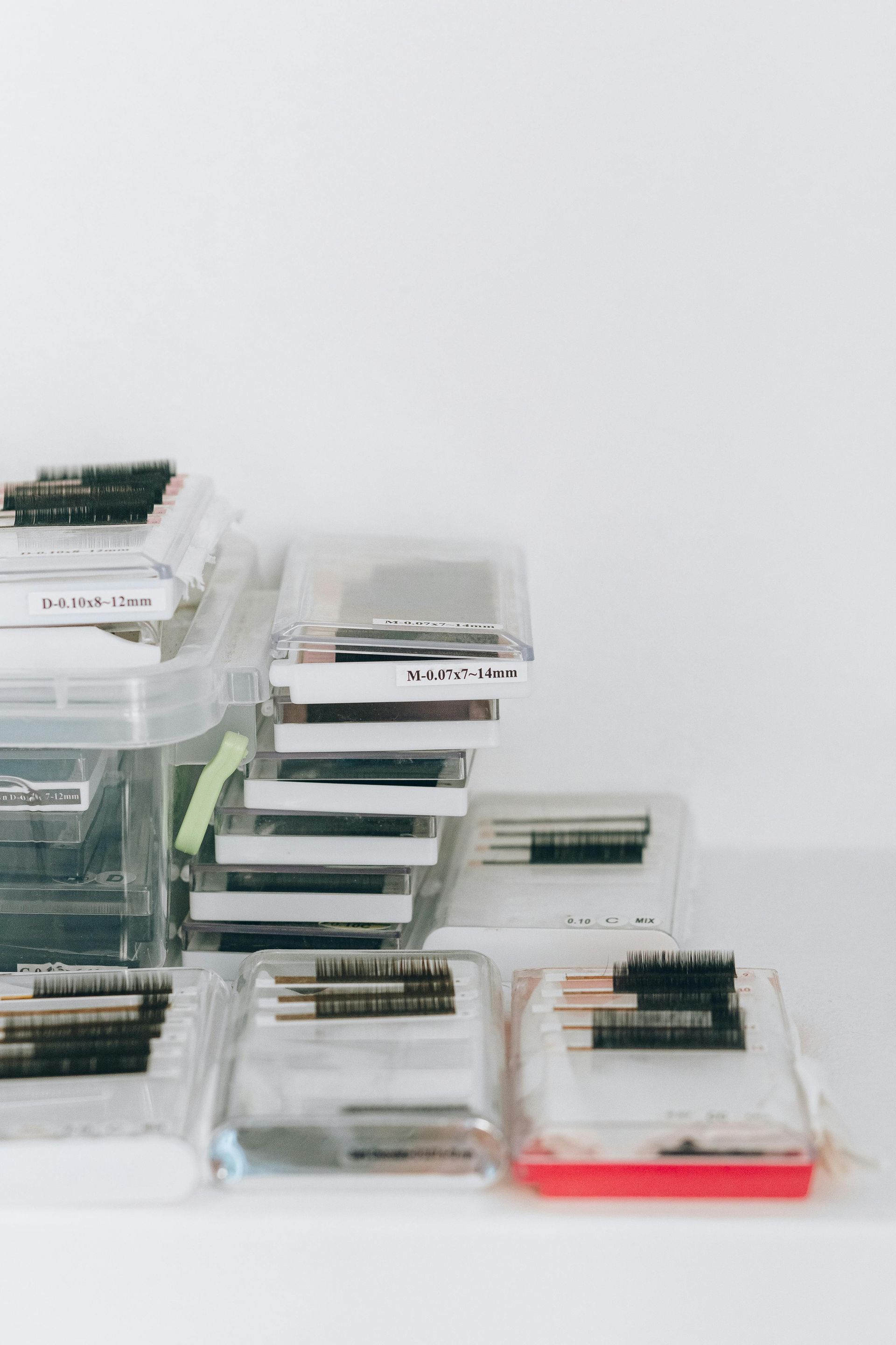 A stack of makeup brushes sitting on top of each other on a table.
