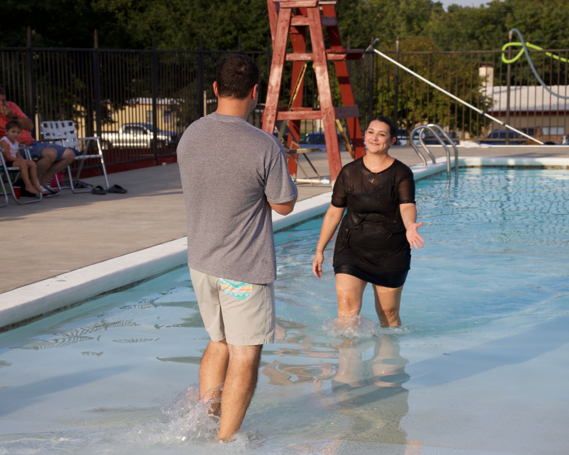 A man and a woman in a pool