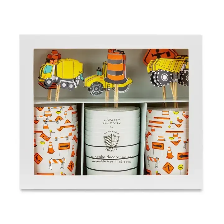 A box of construction themed cupcake toppers and cups