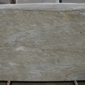 Large slab of light green and gray marble with swirling patterns.