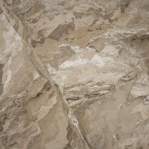 Tan and gray rock face with diagonal crack.