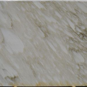 White marble slab with tan veining.