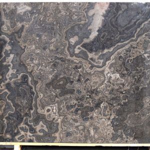 Dark marble slab with swirling gray and beige patterns.