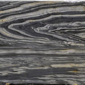 Swirled pattern of gray, black, and white layered rock with a folded, V-shaped section.