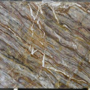 Brown, gray, and white marble with swirling veining.