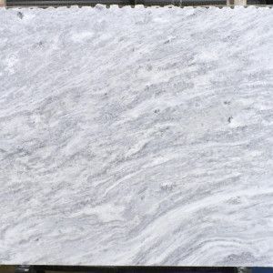White marble slab with swirling gray veining.