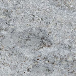 White granite countertop with gray and brown specks.
