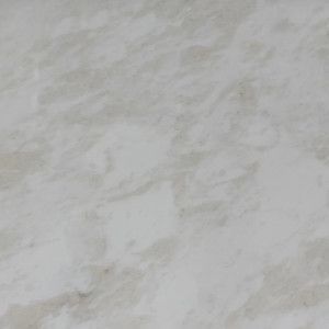 Creamy-white countertop with marbled, light brown veining.