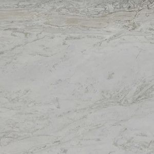 White marble surface with gray and tan veining.