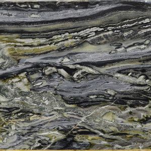 Swirling marble slab in shades of gray, black, and gold.