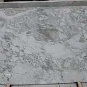 Large slab of gray and white marble with veining, possibly for countertops or flooring.