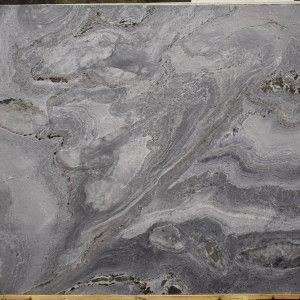 Gray and blue marble slab with flowing, swirled patterns.