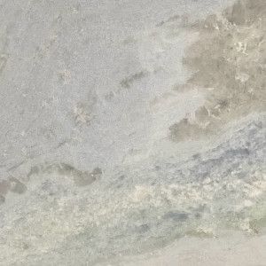 Textured pale blue and gray marble stone.