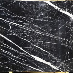 Black marble slab with bold white veining.
