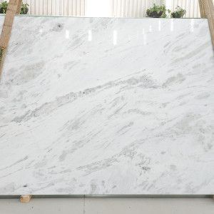 White marble slab with gray veining, possibly for countertops or flooring.