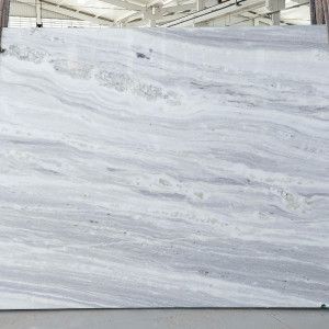 Large, white marble slab with gray and light blue veining.