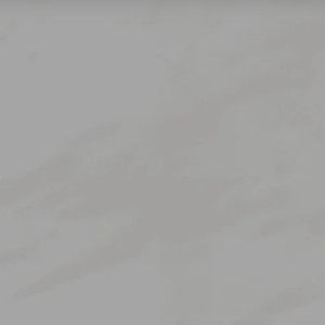 Plain light gray wall with subtle textured variations.