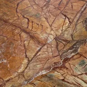 Brown and reddish marble with dark veining and lighter streaks.