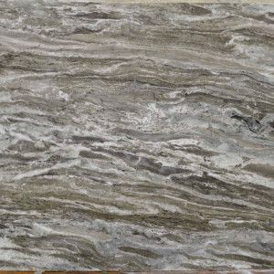 Swirling gray, white, and brown patterned marble slab.