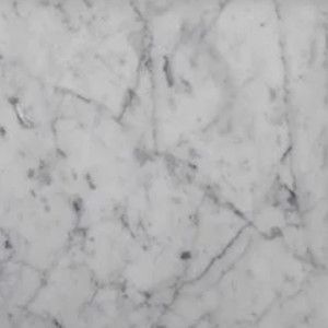 White marble surface with gray veining.