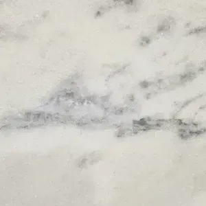 White marble with gray veining, possibly for countertop or surface.
