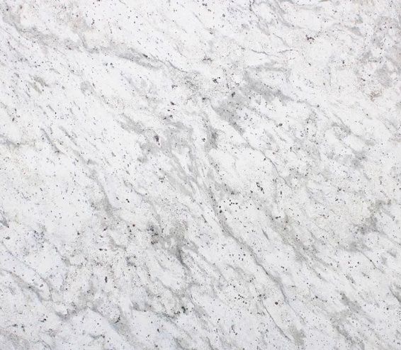 White and gray marble surface with veining and flecks.
