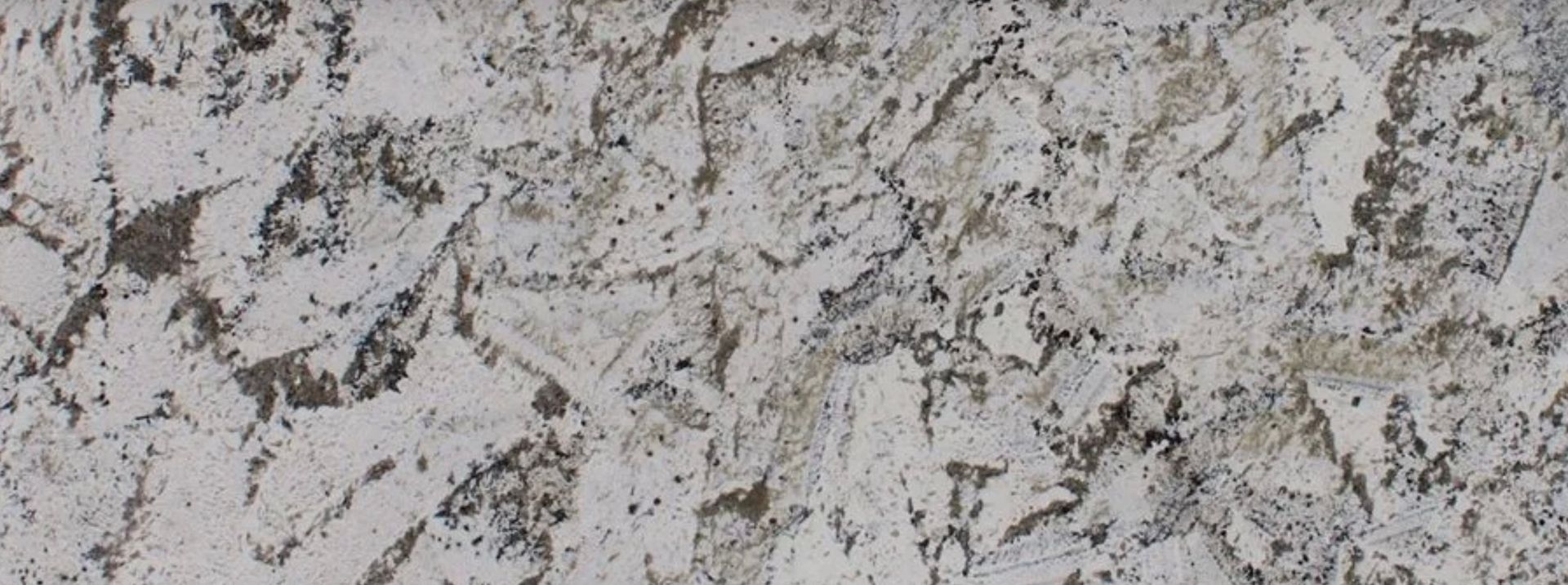 Granite countertop with a speckled pattern of white, gray, and black.