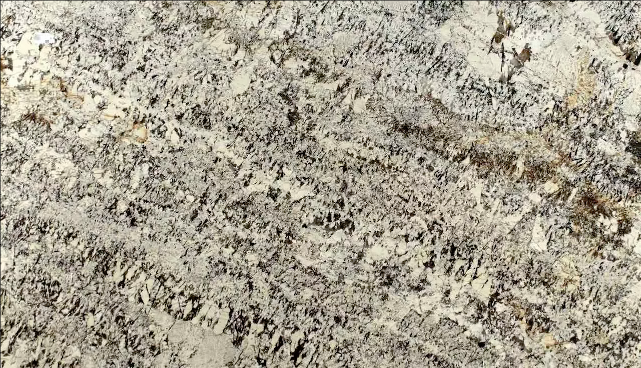 Granite countertop with a mottled pattern of beige, gray, and brown colors.