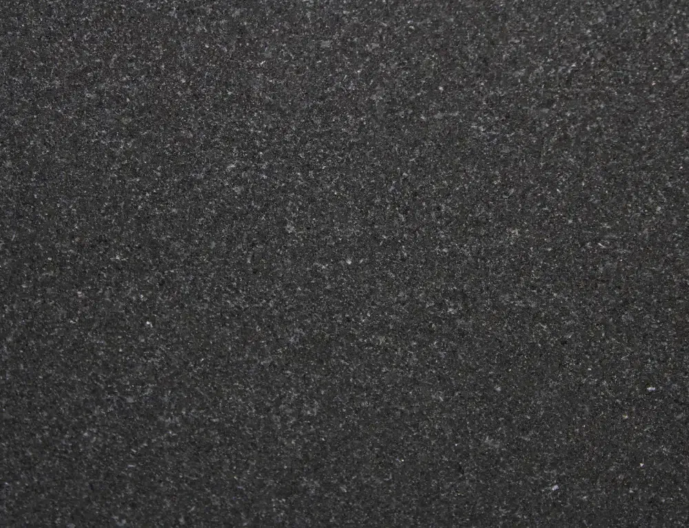 Dark gray, speckled texture.