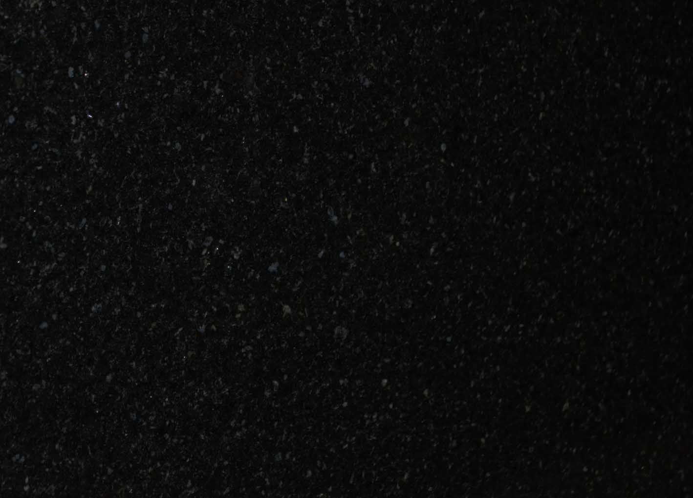 Black speckled surface.