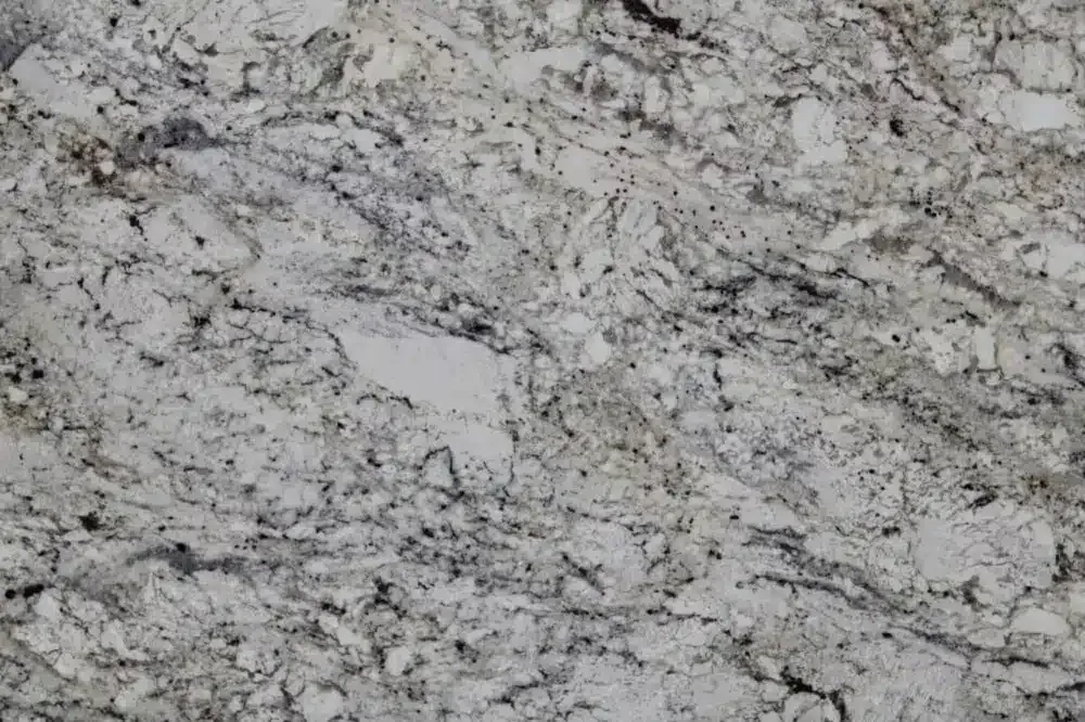 Granite countertop with a swirling pattern of white, gray, and black.