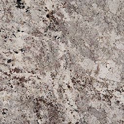 Close-up of granite countertop with cream, gray, and dark brown speckled patterns.