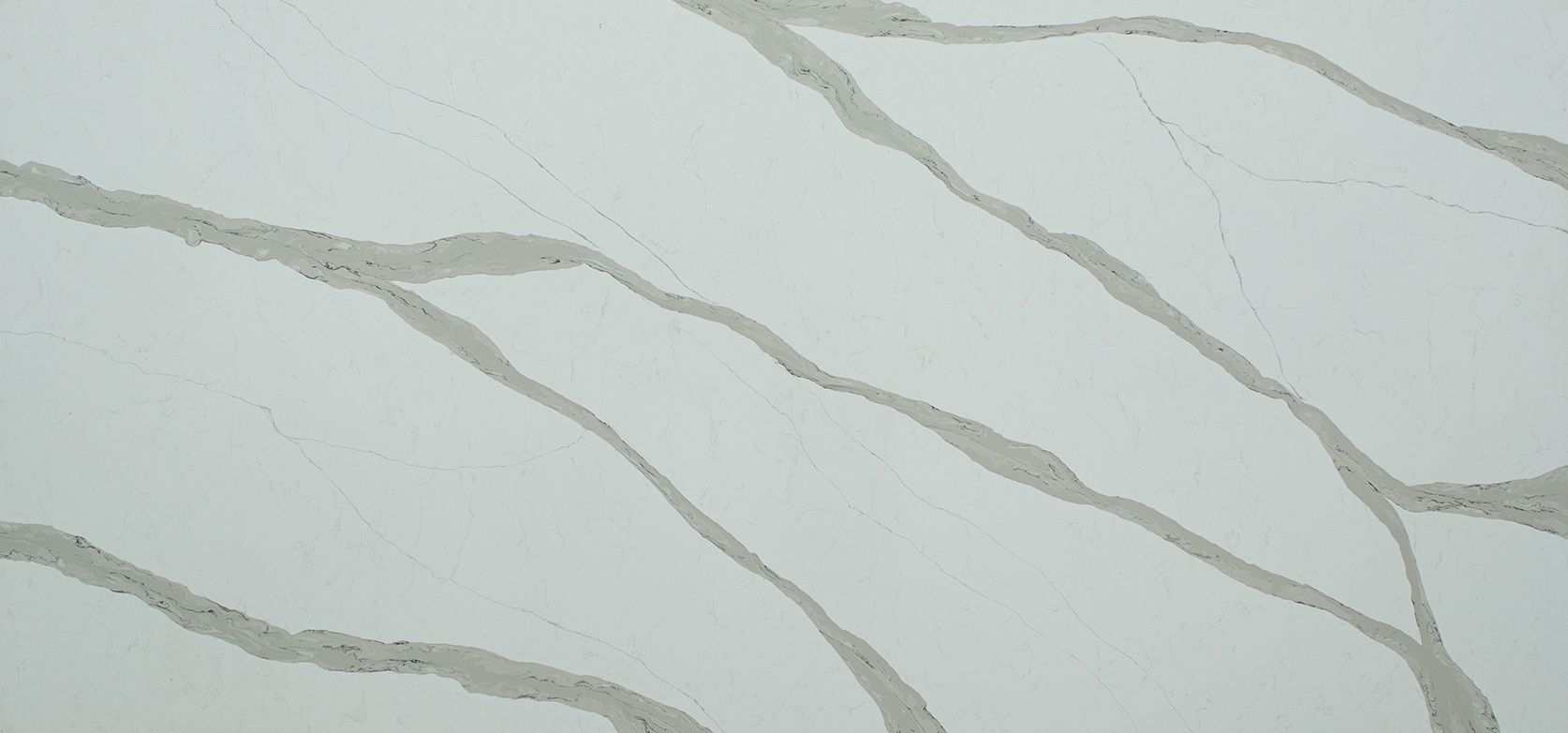 White surface with gray veining, resembling marble or quartz.