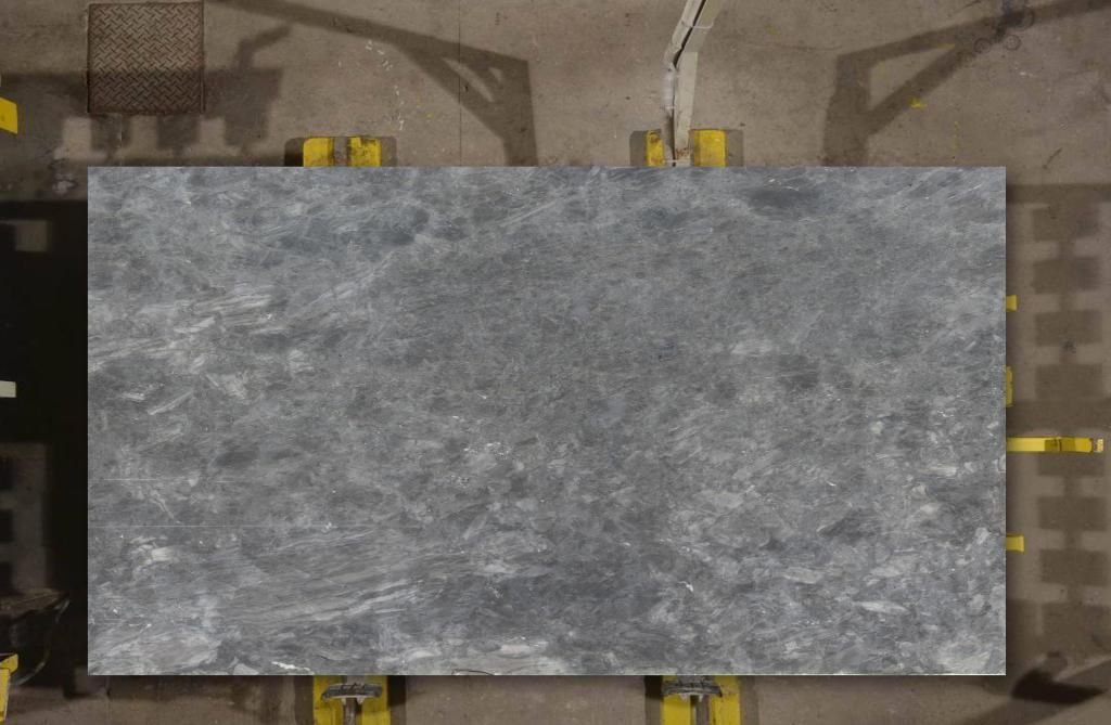 Gray stone slab on yellow supports, seen from above.