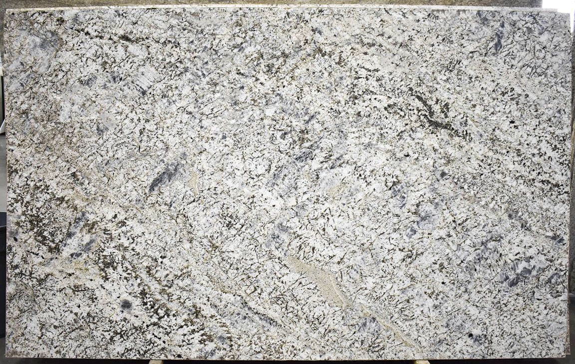 Granite slab with a speckled pattern of white, gray, and black minerals.