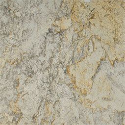 Close-up of a beige and gold granite slab with swirling patterns and textured surface.