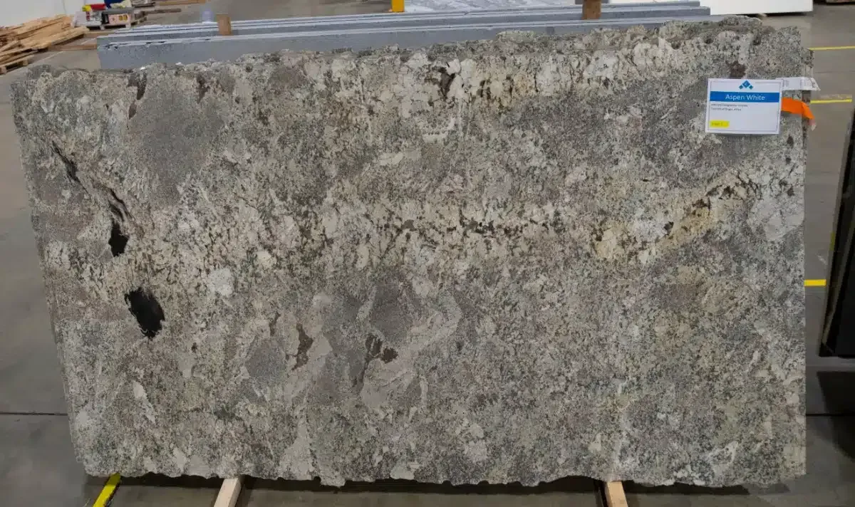 Large granite slab with gray and brown mottled patterns.