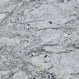 Gray and white granite countertop with flowing veins and dark speckles.
