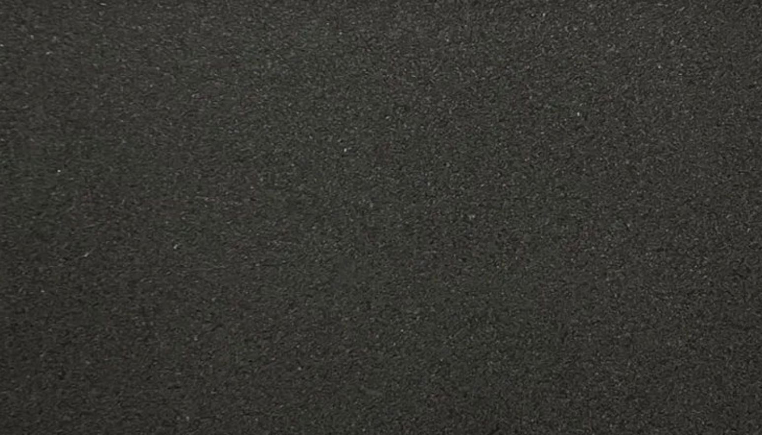 Dark gray foam material, closely textured surface.