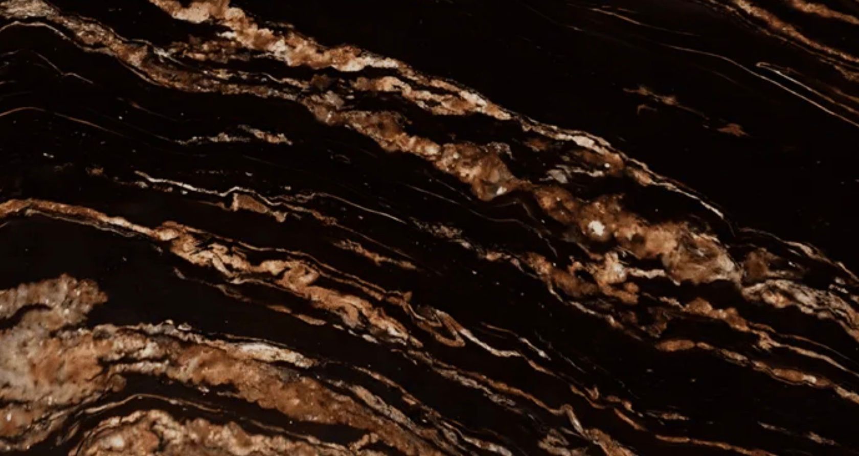 Dark brown and tan marble with swirling patterns.