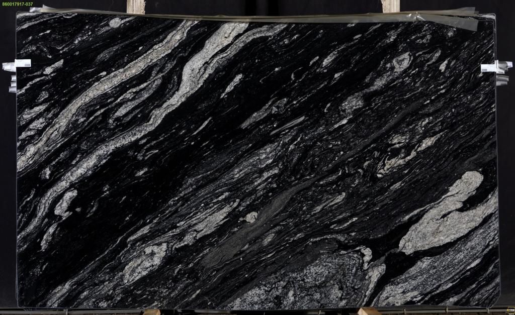 Black granite slab with swirling gray veining.