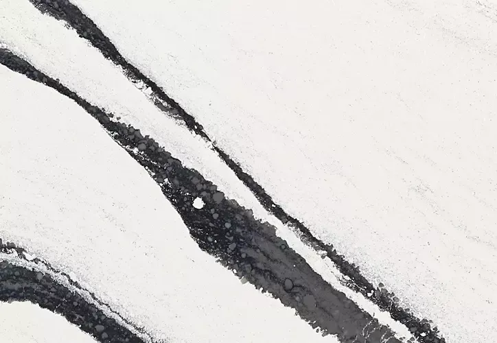 White and gray veined marble pattern. Diagonal gray and black streaks on a white background.