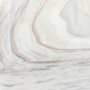 White marble slab with grey and brown veining.