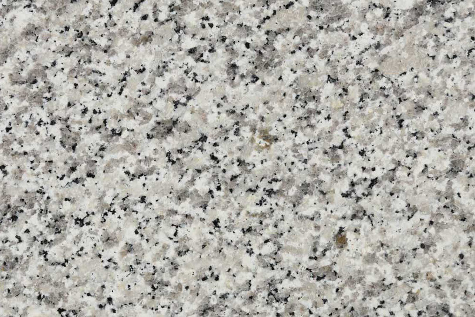 Granite countertop with speckled gray and black pattern on a light gray background.