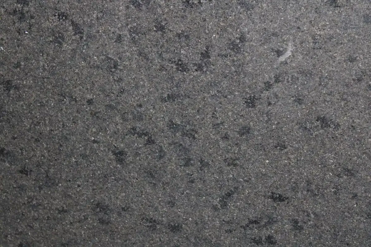 Gray asphalt with dark spots.