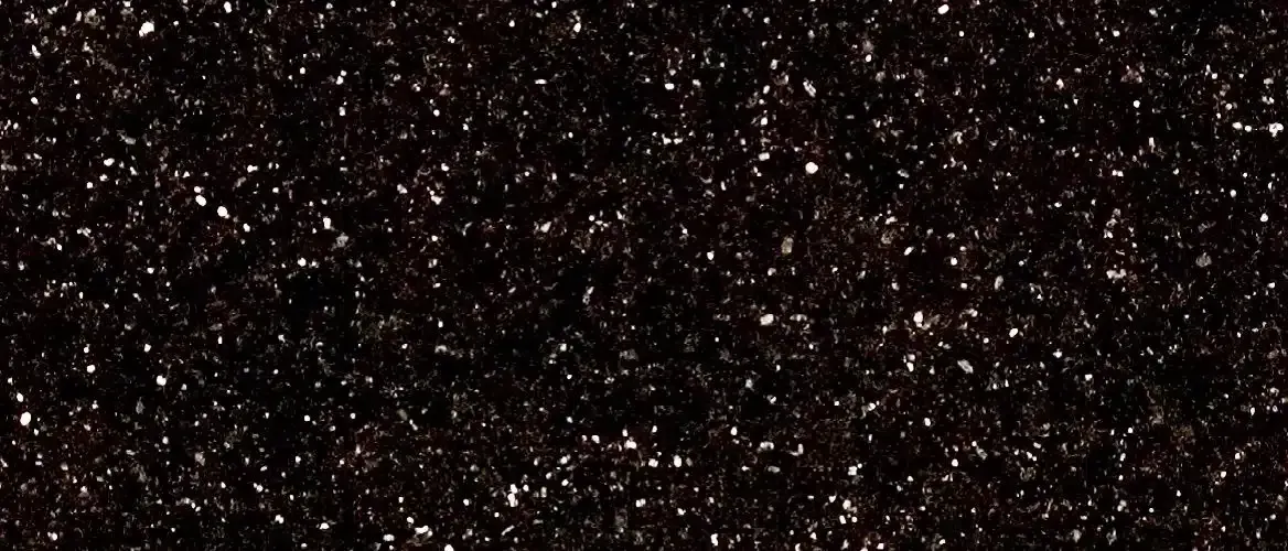 Dark speckled background with silver and white highlights.