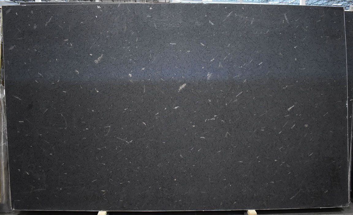 Black granite slab with white speckles and streaks.