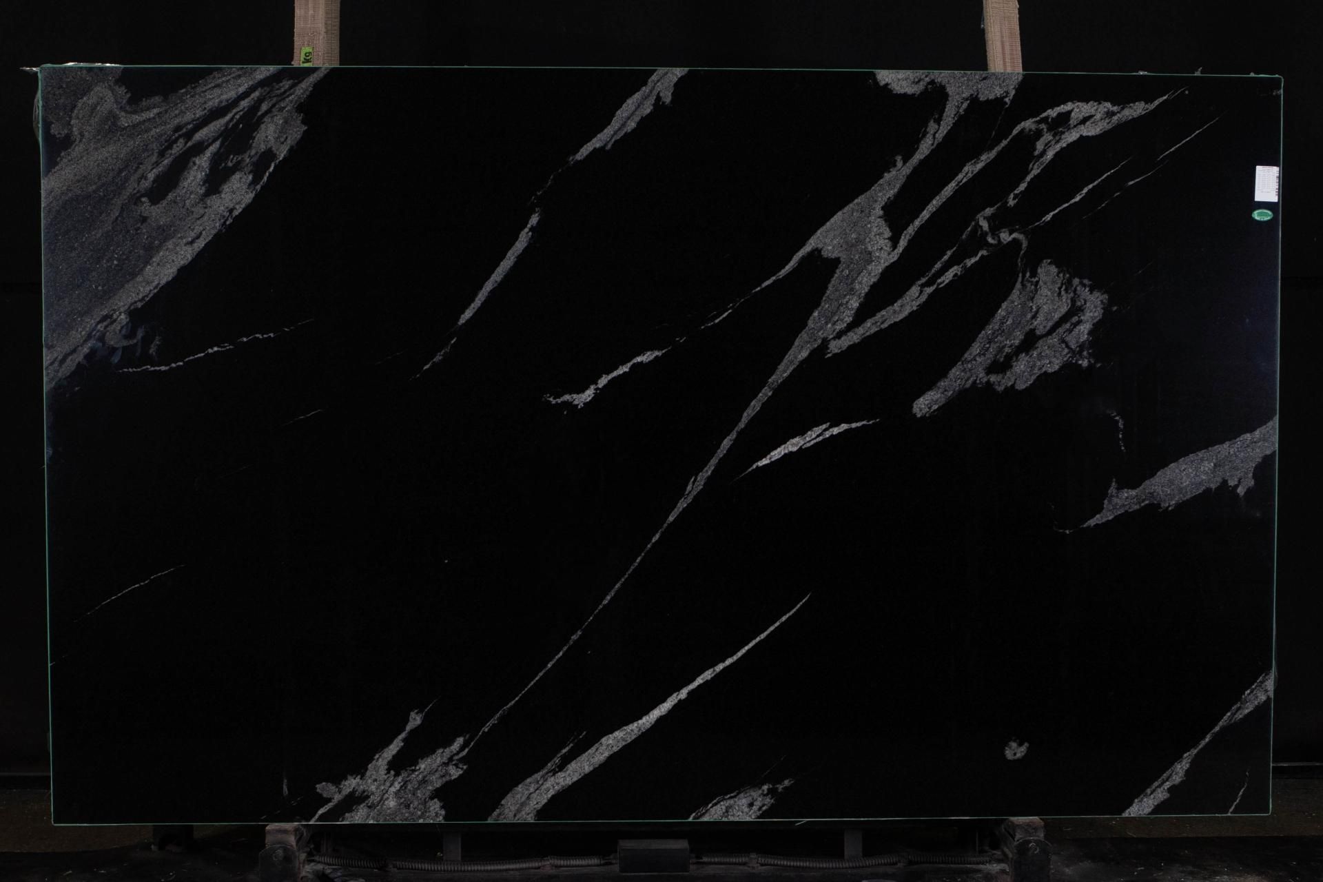 Black granite slab with prominent silver veining.