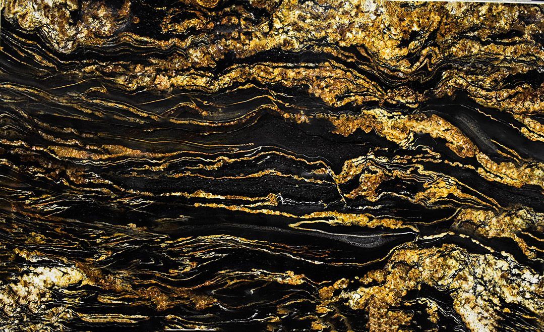 Black and gold granite countertop with swirling patterns.